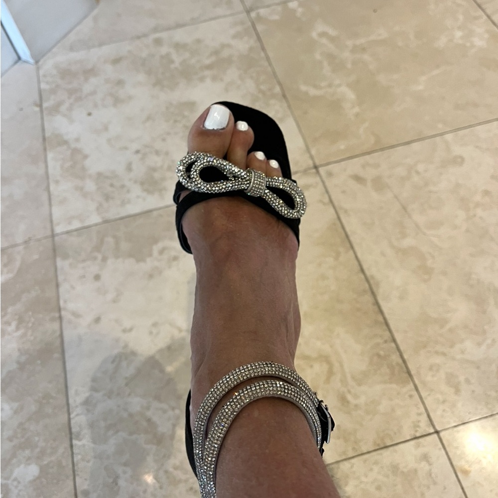 Brand new black suede heels with diamond bow and diamond ankle strap.